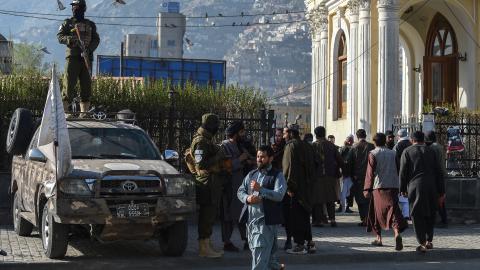 Taliban security personnel stand guard as Muslim devotees arrive in Kabul on March 30, 2025. (Ahmad Sahel Arman via Getty Images)