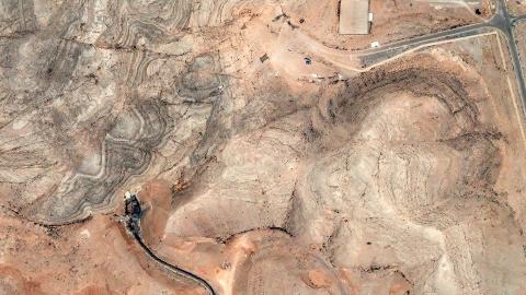 Maxar satellite image shows visible craters and destruction at multiple tunnel entrances following US airstrikes on the Isfahan research center on June 22, 2025. (Satellite Image via Getty Images)