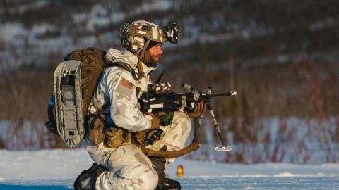 A 10th Special Forces Group Green Beret provides security on the drop zone March 31, 2023. (U.S. Army photo by Sgt. Luis M. Solorio)