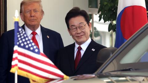 US President Donald Trump greets South Korean President Lee Jae Myung as he arrives at the West Wing entrance of the White House in Washington, DC, on August 25, 2025. (Saul loab via Getty Images) Share to Twitter
