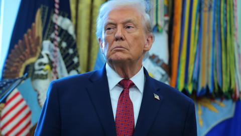 President Donald Trump listens during a ceremony in the Oval Office of the White House on December 15, 2025, in Washington, DC. (Getty Images)