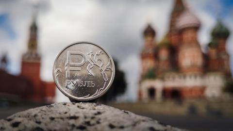 A Russian ruble coin is pictured in front of the Kremlin in Moscow on September 12, 2025. (Getty Images)