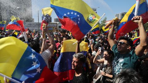 Venezuelans living in Chile celebrate in Santiago on January 3, 2026, after US forces captured Venezuelan leader Nicolas Maduro. (Getty Images) Share to Twitter