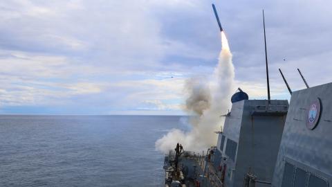 The guided-missile destroyer USS Thomas Hudner fires a Tomahawk cruise missile in support of Operation Epic Fury on March 1, 2026. (US Navy)