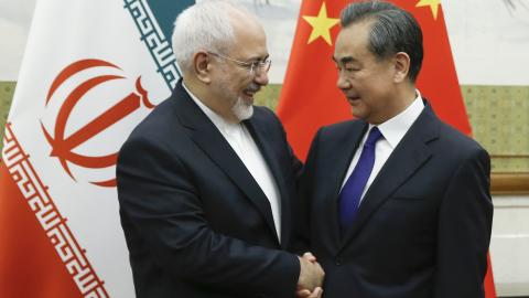 Caption Chinese State Councillor and Foreign Minister Wang Yi meets Iran’s Foreign Minister Mohammad Javad Zarif at the Diaoyutai state guesthouse in Beijing on May 13, 2018. (Getty Images) 