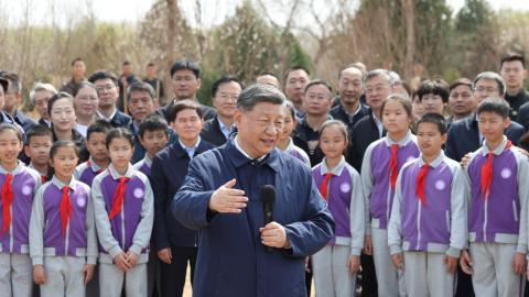 Chinese President Xi Jinping, also general secretary of the Communist Party of China Central Committee and chairman of the Central Military Commission, talks with the crowd on site during a voluntary tree-planting activity at Baishan Town in Changping District of Beijing, capital of China, March 30, 2026. Xi and other Party and state leaders, including Li Qiang, Zhao Leji, Wang Huning, Cai Qi, Ding Xuexiang, and Li Xi, took part in a voluntary tree-planting activity in Changping District of Beijing on Monda