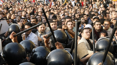 Egyptian demonstrators clash with Egyptian police in central Cairo during a protest to demand the ouster of President Hosni Mubarak and calling for reforms on January 25, 2011. (MOHAMMED ABED/AFP/GettyImages)