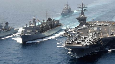 Germany's FGS Hamburg (F220), left, and the aircraft carrier USS Dwight D. Eisenhower (CVN 69), right, with the Military Sealift Command fast combat support ship USNS Bridge (T-AOE 10), center, in the Arabian Sea on March 23, 2013. (U.S. Navy/Released)