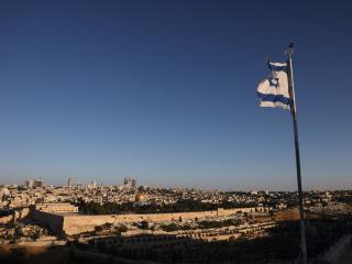 An Israeli flag flutters on the Mount of Olives in Jerusalem on June 13, 2025. (Getty Images)