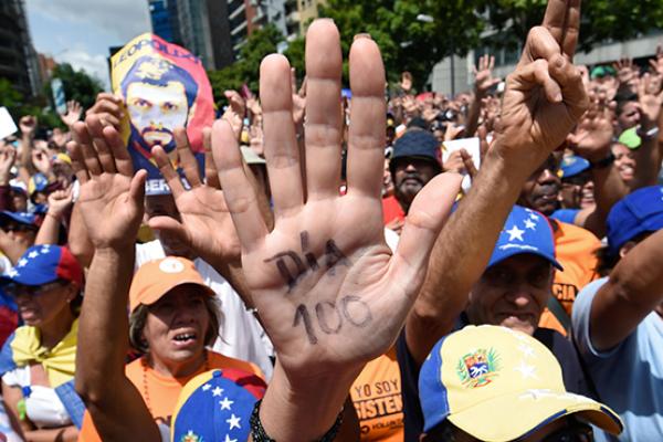 Opposition activists take part in a demonstration against President Nicolas Maduro in Caracas on July 9, 2017 (Juan Barreto/AFP/Getty Images)