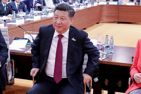 U.S. President Trump, Chinese President Jinping, and German Chancellor Merkel at the G20 meeting in Hamburg, July 7, 2017 (PHILIPPE WOJAZER/AFP/Getty Images)
