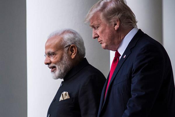 President Donald Trump walks to a joint statement in the Rose Garden with Indian Prime Minister Narendra Modi at the White House in Washington, DC.