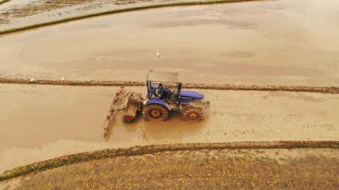 JI'AN, CHINA - MARCH 20: Aerial view of a tractor plowing a field during the Spring Equinox on March 20, 2021 in Ji'an, Jiangxi Province of China. The Spring Equinox starts on March 20 this year. (Photo by Deng Heping/VCG via Getty Images)