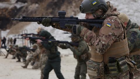 Participants drill shooting positions at a combat training day hosted by a local paramilitary civil formation called TSEL on February 22, 2023, in Lviv, Ukraine. (Sean Gallup/Getty Images)