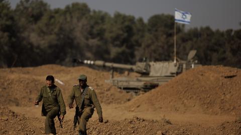  Soldiers from an Israeli artillery unit wait for orders to fire from the Israeli side of the border toward the Gaza Strip on November 6, 2023, in southern Israel. (Photo by Dan Kitwood/Getty Images)