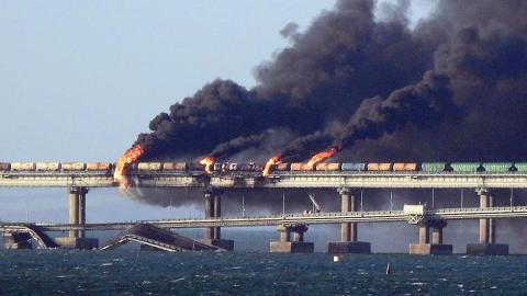 Black smoke billows from a fire on the Kerch bridge that links Crimea to Russia after a truck exploded near Kerch on October 8, 2022. (AFP via Getty Images)