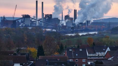 In this aerial view water vapor and exhaust rise from the steel mill of Salzgitter AG, one of Europe's largest steel producers, as residential buildings stand nearby on November 22, 2023 in Salzgitter, Germany. (Sean Gallup via Getty Images)