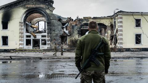 A Ukrainian soldier stands in front of railroad station destroyed by Russian shelling on March 15, 2024, in Kostiantynivka, Ukraine. (Photo by Serhii Mykhalchuk/Global Images Ukraine via Getty Images)