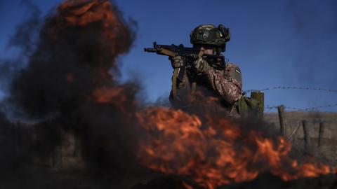 A member of a Ukrainian artillery brigade during a training session near Chasiv Yar, Ukraine, on February 27, 2024. (Photo by Cristopher Rogel Blanquet/Getty Images)