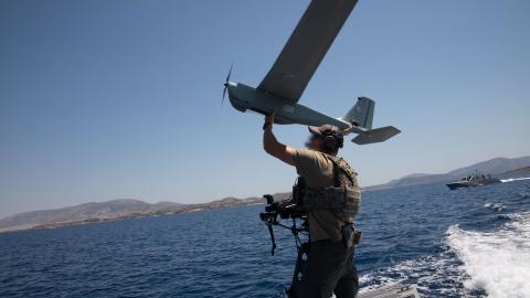 A U.S. Navy Special Warfare Combatant-Craft Crewman assigned to Naval Special Warfare deploys the Puma All Environment Unmanned Aircraft System during a training mission with Hellenic Navy special operators from the Underwater Demolition Command (DYK) in the Aegean Sea near Greece on July 15, 2020.