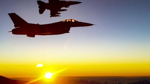 Two US Air Force F-16 Fighting Falcon pilots fly alongside a KC-135R Stratotanker over Southwest Asia on December 4, 2020.