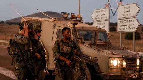 Israeli soldiers secure a road as rockets are launched from southern Lebanon in Golan Heights on July 9, 2024. (Jalaa Marey/AFP via Getty Images)