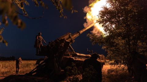 Ukrainian soldiers fire an artillery piece at their combat position in Donetsk Oblast, Ukraine, on July 26, 2024. (Photo by Diego Herrera Carcedo/Anadolu via Getty Images)