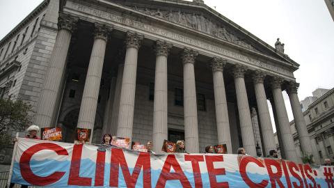 Environmental activists rally for accountability for fossil fuel companies outside of the New York Supreme Court on October 22, 2019, in New York City. (Drew Angerer via Getty Images)