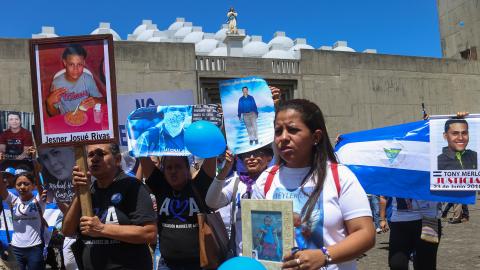 Members of the organization Mothers of April hold portraits of their late loved ones outside the Cathedral in Managua on February 23, 2020. (Inti Ocon/AFP via Getty Images)