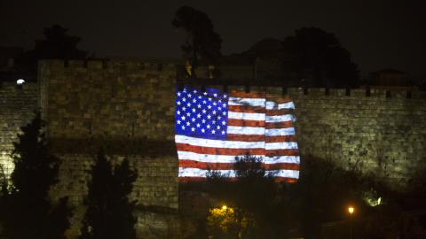 The flag of the United States is projected on the wall of Jerusalem's Old City on December 6, 2017, in Jerusalem, Israel. (Lior Mizrahi via Getty Images)