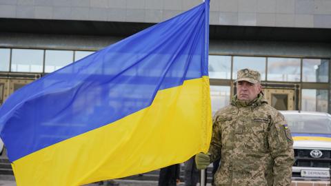 Ukrainian military holds a flag of Ukraine as they receive equipment from Lithuania on November 4, 2024, in Kyiv, Ukraine. (Ihor Kuznietsov/Global Images Ukraine via Getty Images)