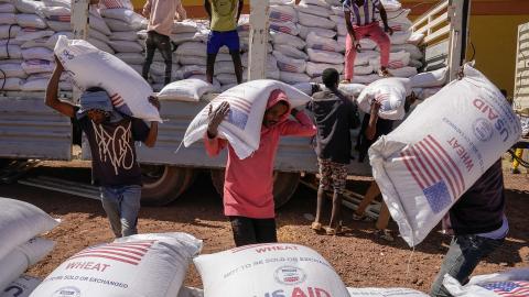 Volunteers at the Zanzalima Camp for Internally Displaced People unload 50 kilogram saks of Wheat flour that were a part of an aid delivery from USAID on December 17, 2021 in Bahir Dar, Ethiopia. USAID started delivering food aid to the camp in September 2021 that currently houses over 5000 IDP's. The IDP's housed in this one camp hail from the cities of Dessie, Kombolcha, Hayk, Woldeyia and Sekota and came to the camp to escape the TPLF invasion of the Amhara and Afar regions which is said to be responsibl