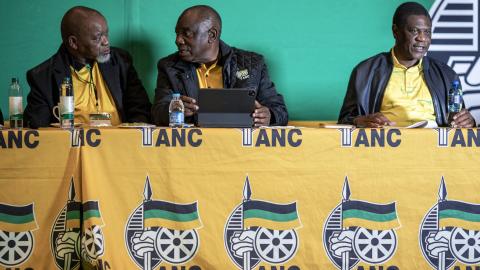 African National Congress President Cyril Ramaphosa speaks to the National Chairperson Gwede Mantashe before a Lekotla meeting on August 4, 2024, in Boksburg, South Africa. (Per-Anders Pettersson via Getty Images)