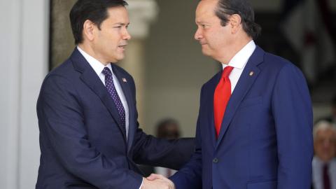 Panama's Foreign Minister Javier Martinez-Acha shakes hands with US Secretary of State Marco Rubio at the presidential palace on February 2, 2025, in Panama City. (MARK SCHIEFELBEIN/POOL/AFP via Getty Images)
