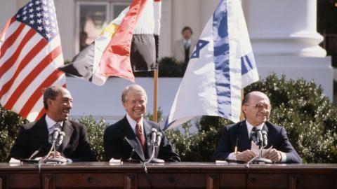 Egyptian President Anwar el-Sadat, US President Jimmy Carter, and Israeli Prime Minister Menachem Begin sit together outside the White House on March 26, 1979. (Wally McNamee/Corbis via Getty Images)