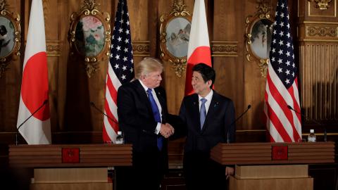 President Donald Trump and Japanese Prime Minister Shinzo Abe shake hands following their meeting at Akasaka Palace in Tokyo, Japan, on November 6, 2017. (Kiyoshi Ota/Anadolu Agency via Getty Images)