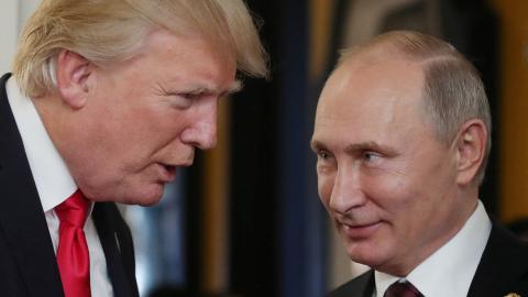 US President Donald Trump chats with Russia's President Vladimir Putin as they attend the Economic Leaders' Meeting in the Vietnamese city of Danang on November 11, 2017.(MIKHAIL KLIMENTYEV/SPUTNIK/AFP via Getty Images)