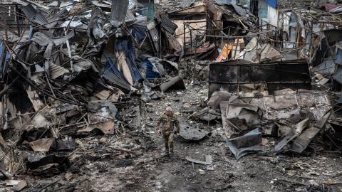 Ukrainian military walk through the destruction after a large scale Russian attack on a residential complex on March 7th that killed 11 people and injured 47 on March 10, 2025 in Dobropillia, Ukraine. U.S. President Donald Trump's recent decision to pause intelligence sharing with Kyiv has sparked concerns in Ukraine that Russian missile strikes could now strike cities without prior warning. (Photo by Paula Bronstein / Getty Images)