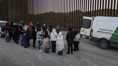 Immigrants wait to be transported by US Border Patrol agents after crossing the US-Mexico border on January 20, 2025, near Sasabe, Arizona. (John Moore via Getty Images)