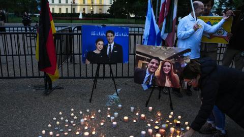 A mourner lights a candle during a vigil for the victims of the Capital Jewish Museum shooting outside of the White House on May 22, 2025, in Washington, DC. (Kevin Dietsch via Getty Images)