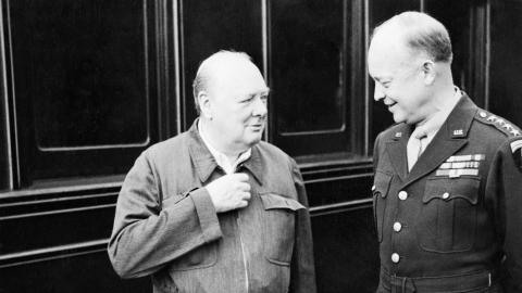 Winston Churchill shows off his famous “siren suit” to General Dwight D Eisenhower during a tour of Allied invasion forces in Kent, England, on May 12, 1944 (Wikimedia Commons).