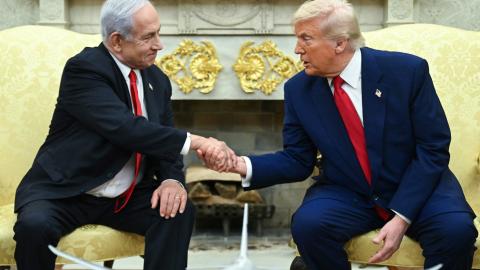 US President Donald Trump shakes hands with Israeli Prime Minister Benjamin Netanyahu during a meeting in the Oval Office of the White House in Washington, DC, on April 7, 2025. (Saul Loeb via AFP)