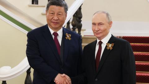 Russia's President Vladimir Putin greets Chinese President Xi Jinping in Moscow on May 9, 2025. (Mikhail Metzel via Getty Images)