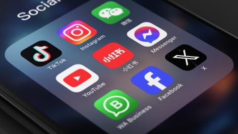 Icons for Tiktok, Instagram, Facebook, Xiaohongshu, Youtube, and WeChat are seen on a phone. (Getty Images)