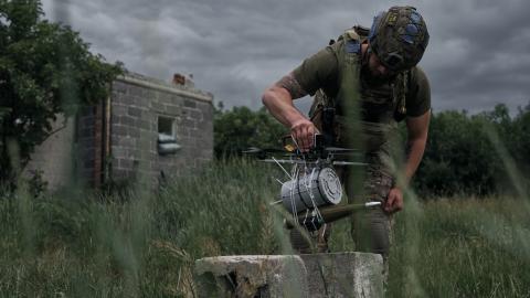 Pilots of the 28th Mechanized Brigade of the Armed Forces of Ukraine test a fiber optic drone with RPG munition on June 18, 2025, near Kostiantynivka, Ukraine. (Kostiantyn Liberov via Getty Images)