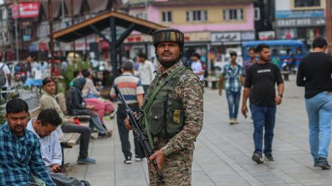 An Indian security personnel stands guard along a street in Srinagar, Jammu and Kashmir, on July 15, 2025. (Firdous Nazir via Getty Images)