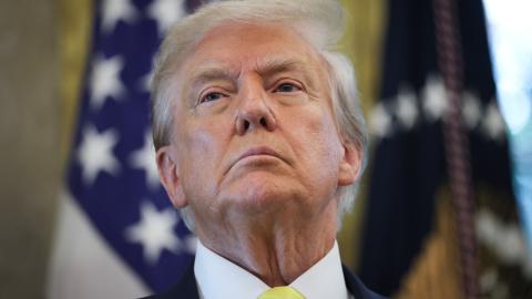 US President Donald Trump listens to questions from reporters after speaking on economic data in the Oval Office on August 7, 2025, in Washington, DC. (Win McNamee via Getty Images)