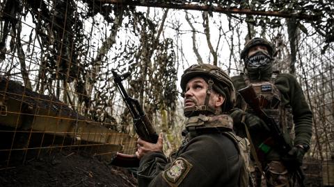 Soldiers from an artillery unit watch a drone flying above the caponier of their artillery weapon during a combat mission in the Pokrovsk direction in the Donetsk region, Ukraine, on December 11, 2025. (Getty Images)