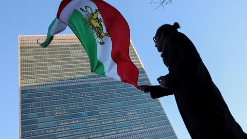 A protester waves the pre-Islamic Revolution Iranian flag outside UN headquarters during a United Nations Security Council meeting on Iran in New York on January 15, 2026. (Getty Images)