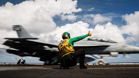 A U.S. Sailor signals the launch of an F/A-18F Super Hornet aircraft, attached to Strike Fighter Squadron 213, on the flight deck of the world’s largest aircraft carrier, Ford-class aircraft carrier USS Gerald R. Ford (CVN 78), while underway in the Caribbean Sea, Jan. 30, 2026. U.S. military forces are deployed to the Caribbean in support of the U.S. Southern Command mission, Department of War-directed operations, and the president’s priorities to disrupt illicit drug trafficking and protect the homeland. 